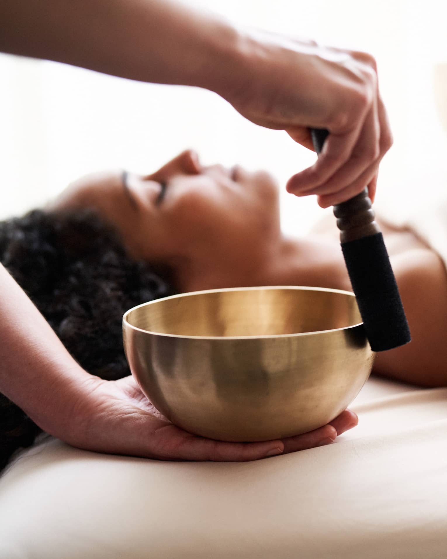 A sound healing session with a singing bowl